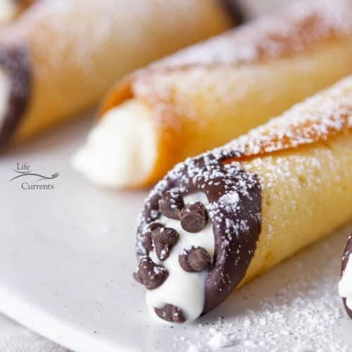 Delicious homemade cannoli cookies with a creamy filling and chocolate chips.